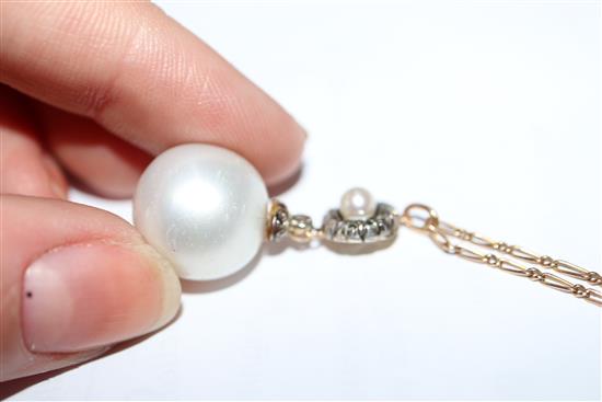 A yellow metal, rose cut diamond and cultured pearl set drop pendant, on a yellow metal chain, pendant approx. 28mm.